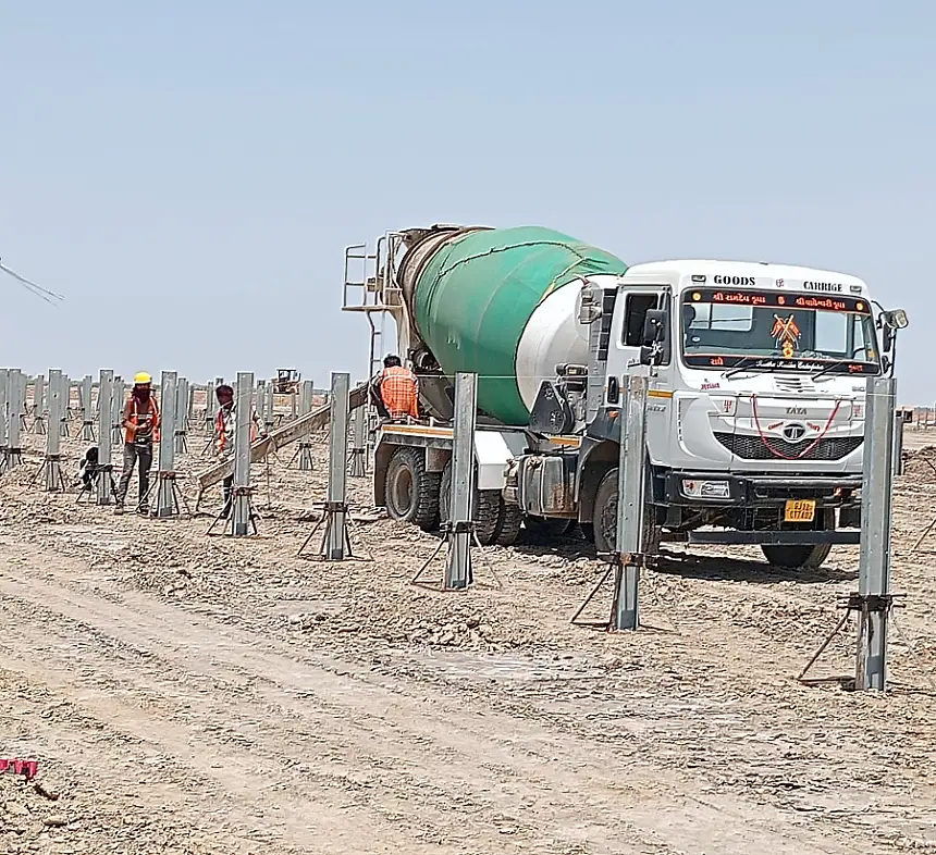 Transit mixer pouring pile foundations on a Rajasthan solar block